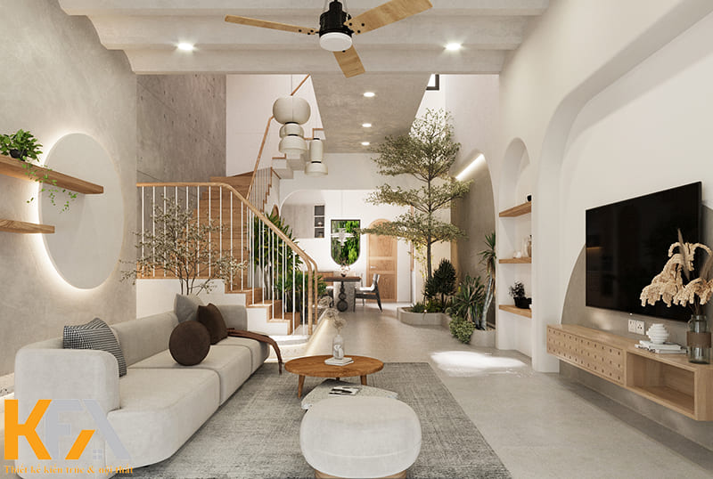 Nhà ống có đặc trưng với thiết kế cầu thang lưu thông các tầng nên gia chủ có thể khéo léo tận dụng làm vách ngăn phòng khách và phòng bếp