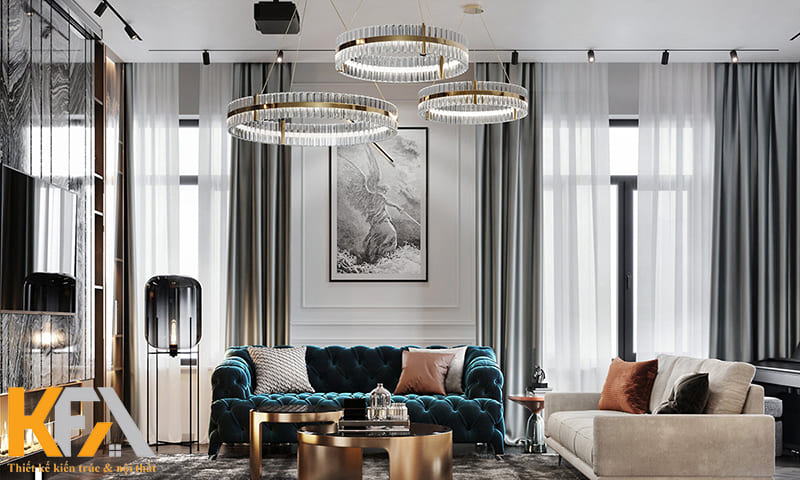 Chiếc sofa nhung xanh giúp phòng khách nhân đôi sự sang trọng